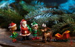 Christmas tree decorations. Santa Claus with elves and reindeer.