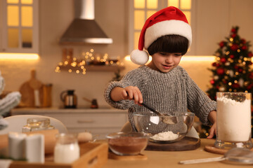 Poster - Cute little boy making Christmas cookies in kitchen