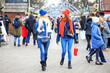 © Olha Tsiplyar - Two friends met at the Christmas market and are walking. Women communicate and buy gifts.