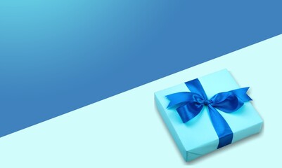 Wall Mural - Beautiful gift box with ribbon wrapped as bow abstract background