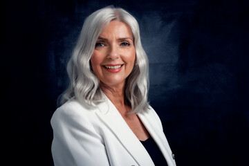 Wall Mural - Elegant mature business woman with grey hair. Studio portrait.