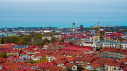 Wall Mural - Gothenburg, Sweden. Aerial view of the city center of Gothenburg, Sweden during the sunset from evening to night. Historical buildings with blue sky. Time-lapse with car traffic