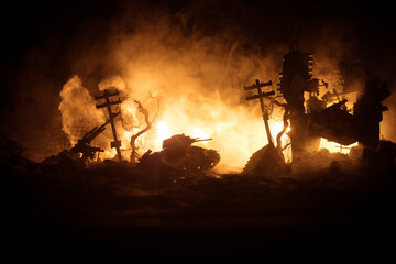 Wall Mural - War Concept. Military silhouettes fighting scene on war fog sky background, World War Soldiers Silhouette Below Cloudy Skyline At night. Battle in ruined city. Selective focus