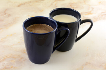 Hot chocolate and hot white chocolate drinks in blue mugs