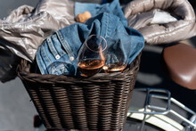 Bicycle Basket Holds Extra Change Of Clothes And Two Champagne Flutes Already Filled With Bubbly Wine.