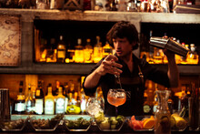 Attractive Bar Tender Making Cocktail In Mexico City