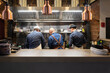 © Cavan Images - Unrecognizable men working in cafe kitchen