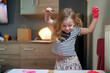 © Cavan Images - Happy smilling cute little girl with raised hands