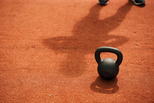 Single Kettle Bell With Shadow Of A Female In The Background