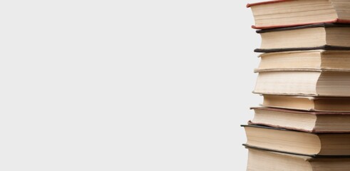 Sticker - Stack of books in the colored cover lay on the table . Education learning concept