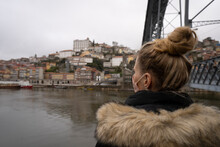 Tourist Wears Face Mask And Admire Dom Luis I Bridge And Douro River