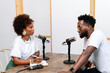 © PICHA - A Black Woman interviewing a guest for a podcast