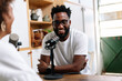 © PICHA - Man recording a podcast