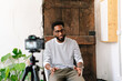 © PICHA - A Black man recording in a video interview