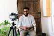 © PICHA - A Black man recording in a video interview