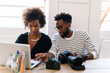 © PICHA - Creatives using a laptop computer