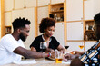 © PICHA - Friends having dinner