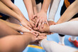 © Cavan Images - Joyful female volleyball team putting hands together
