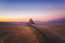 Shiprock Mountain And A Car In The Sunset Light From Above, New Mexico
