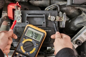 Checking car battery voltage on a car, dead battery