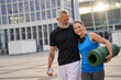 © Kostiantyn - Portrail of sporty mature couple, man and woman in sportswear walking together in the city after morning training