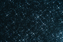 Abstract Deep Blue Background With Sparkles In The Shape Of Stars.