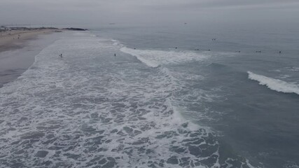 Poster - Aerial view of coastline with people seen surfing and kayaking 