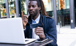 © ADDICTIVE STOCK - Concentrated man paying order in internet shop with credit card