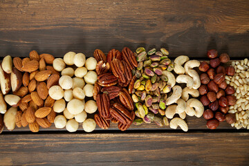 Wall Mural - assortments of nuts on wooden surface