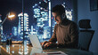 © Gorodenkoff - Portrait of Thoughtful Successful Businessman Working on Laptop Computer in His Big City Office at Night. Charismatic Digital Entrepreneur does Data Analysis for e-Commerce Strategy.