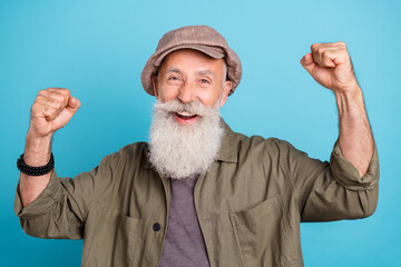 Sticker - Photo of hooray white beard old man hands fists yell wear khaki cap shirt isolated on blue color background