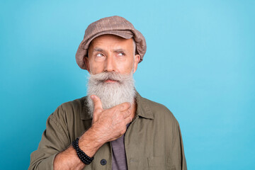 Sticker - Portrait of attractive minded grey-haired man mister touching beard overthinking copy space isolated over bright blue color background