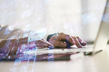 double exposure of abstract programming language hologram with hands typing on laptop on background,