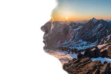Wall Mural - Combination of the silhouette of a man face and a landscape with mountains. Concept of the connection man and nature