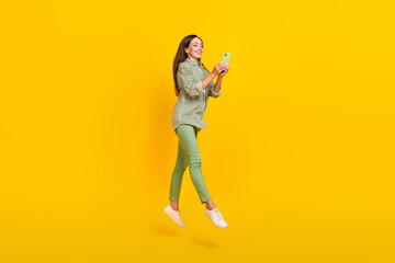 Sticker - Full size profile side photo of young lady use cellphone post comment connection 4g jump isolated over yellow color background