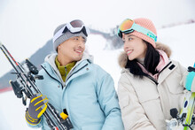 Ski Resorts On Holding The Skis In The Eye Of Happy Couples
