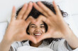 © brizmaker - Afro american woman showing heart shape with hands