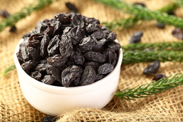 Fresh harvested and sun dried black raisins.