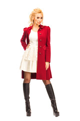 Wall Mural - Young beautiful blonde woman in red coat