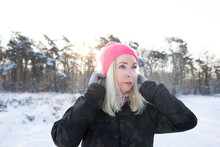 Blond Senior Woman Wearing Pink Knit Hat During Winter