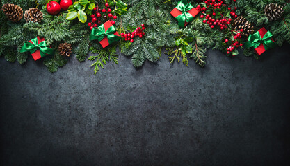 Wall Mural - christmas background with pine branches, berries, decorations and gift boxes