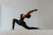 © Westend61 - Female fitness teacher with arms raised bending backwards while practicing yoga