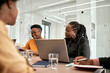 © Westend61 - Female entrepreneurs sitting at desk during meeting in coworking office