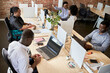 © Westend61 - Male and female entrepreneurs working in coworking office