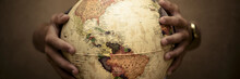 Banner Header With Copy Space For Travel World Concept People. Pair Of Hands Holding Earth Globe
