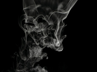 Chaotic mixing smoke creates abstract patterns on a black background