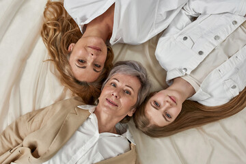 Wall Mural - Top view portrait of three Caucasian women generations