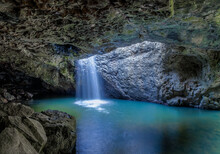Water Flowing Into Pool At The Natural Bridge In The Gondwana Rainforest - Springbrook National Park - Queensland