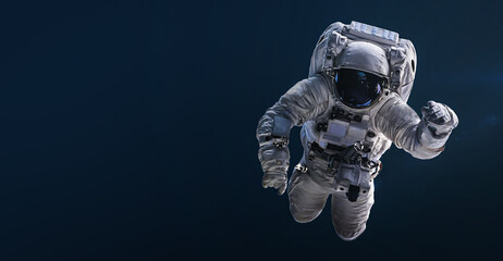 Aufkleber - Astronaut floating and isolated on dark background. Spaceman sci-fi space wallpaper. Elements of this image furnished by NASA

