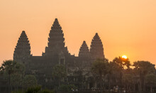 The Sun Rises Beside The Temple Of Angkor Wat.